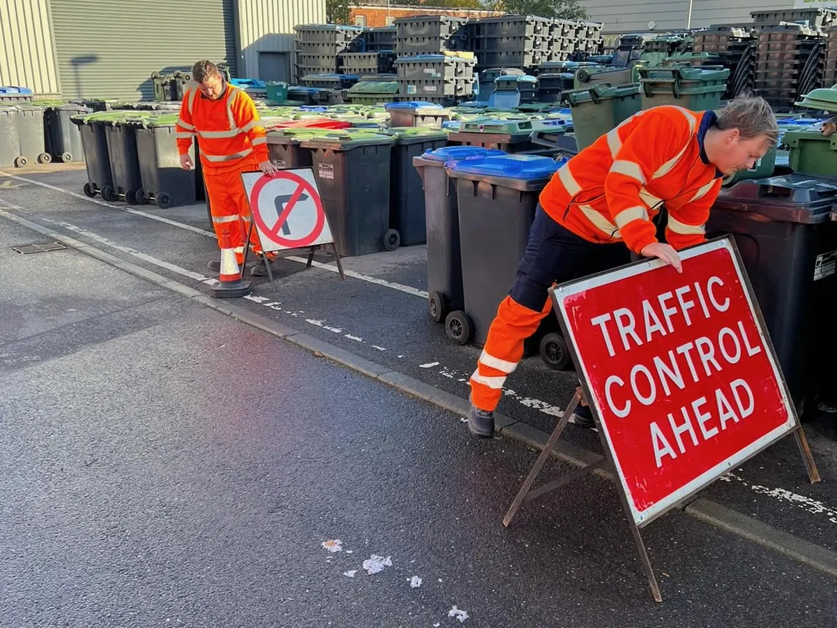 Operatives setting out Traffic Control Ahead and No Left Turn signs on a practical