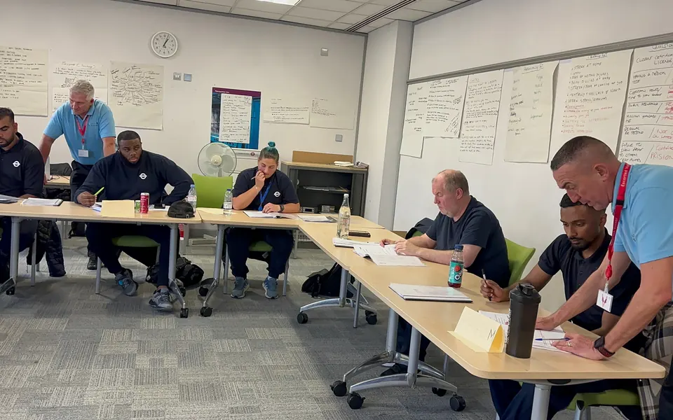 Trainers working the room during a written scenario